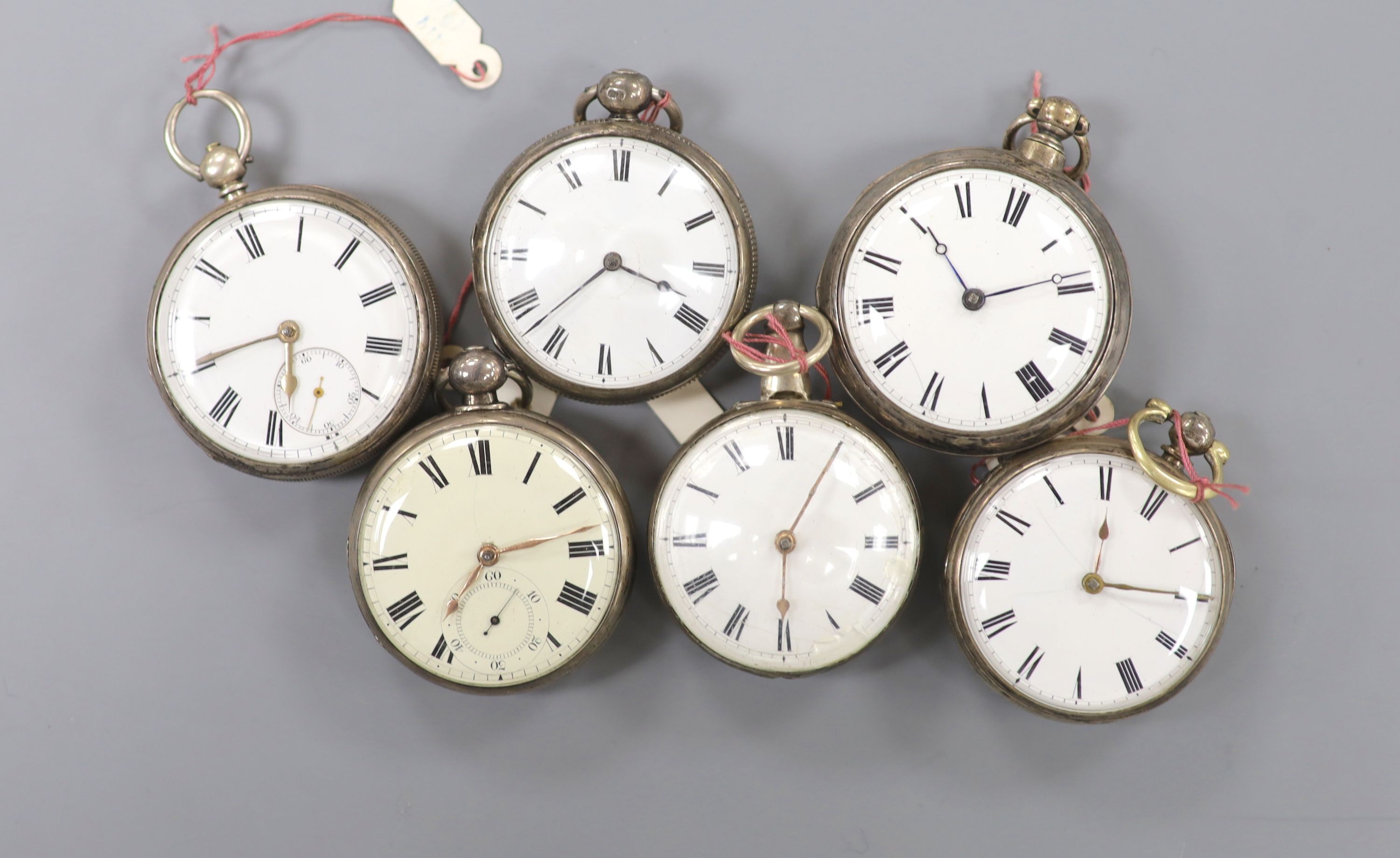 Six assorted 19th century silver keyless verge pocket watches, including pair cased.